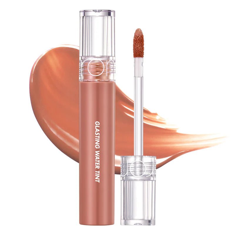 rom&nd Glasting Water Tint in shade Nudy Sundown product image. Lightweight Korean lip tint with a warm nude tone and high-gloss finish. Genuine rom&nd K-beauty lip tint available at Sejou